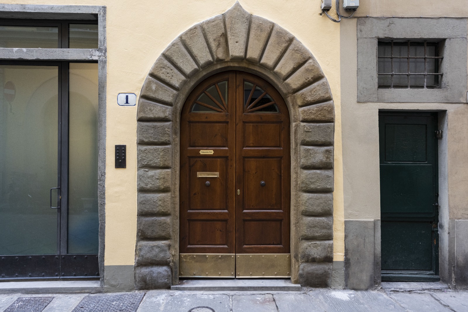Historic arched entrance to Palazzotto Pitti